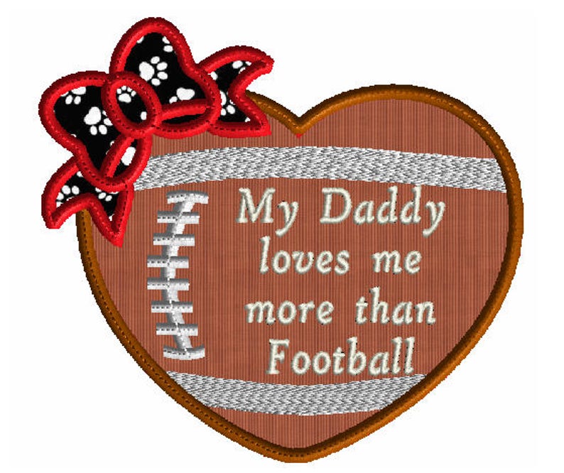 May include: A brown heart-shaped football with a white bow and paw print design. The text "My Daddy loves me more than Football" is written in white on the football.