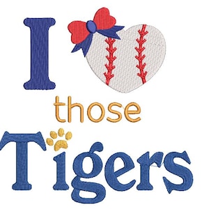 May include: Embroidered design featuring the phrase "I love those Tigers." The design includes a baseball-shaped heart with a red bow, and a paw print. The text and elements are in blue, gold, and red colors, perfect for sports fans.