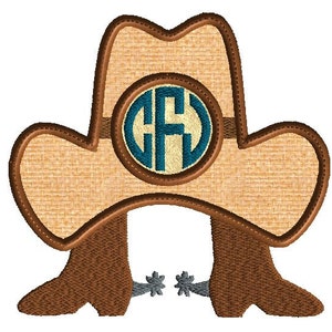 May include: Embroidered cowboy hat with brown boots and a monogrammed circle in the center. The monogram is in blue and white.