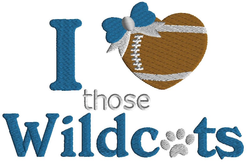 May include: Embroidered design featuring the phrase "I love those Wildcats." The "I" is blue, the heart-shaped football is brown with white stripes and a blue bow. The word "Wildcats" is in blue, with a paw print.