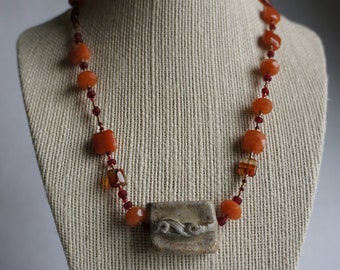 deep orange carnelian necklace with handmade clay pendant