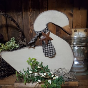 Handmade wooden swan on base