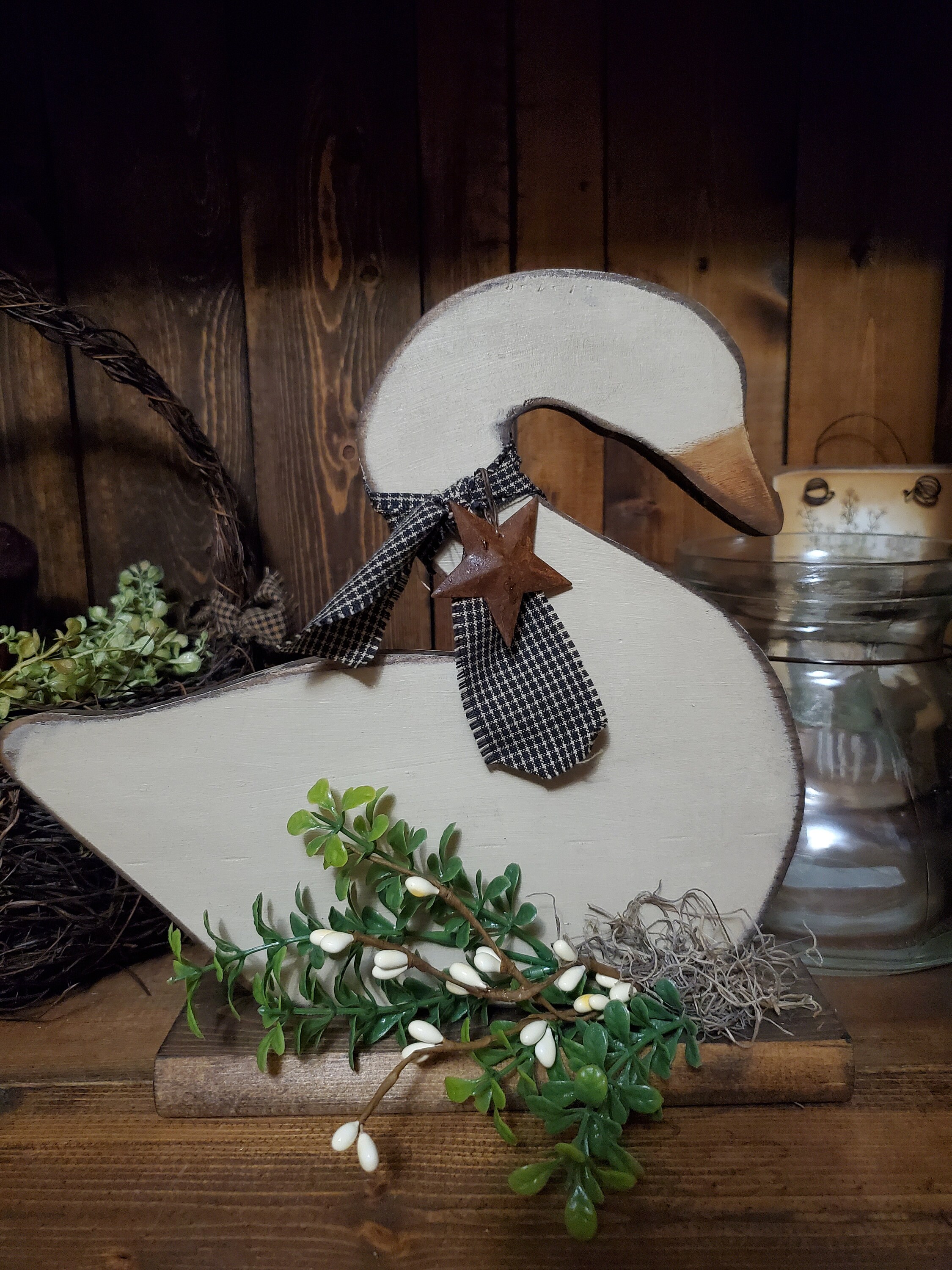 Handmade wooden swan on base