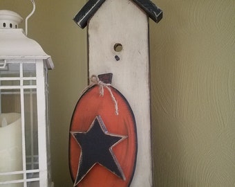 Wooden birdhouse with pumpkin and chunky star