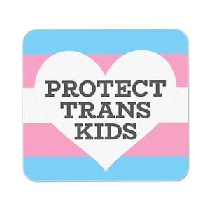 May include: A square sticker with a white heart on a blue, pink, and light blue transgender pride flag background. The heart has the text "PROTECT TRANS KIDS" in black.