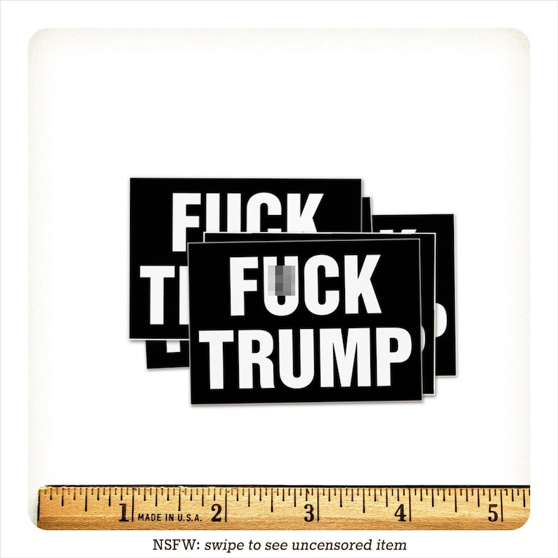 May include: Black rectangular stickers with the words "FUCK TRUMP" in bold white letters. The stickers are stacked, and the text is partially obscured. A ruler is at the bottom, and the text "NSFW: swipe to see uncensored item" is also present.