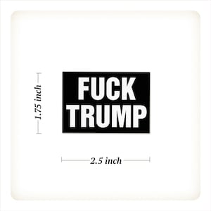 May include: A black rectangular sticker with the words "FUCK TRUMP" in bold white capital letters. The sticker measures 2.5 inches wide and 1.75 inches high.