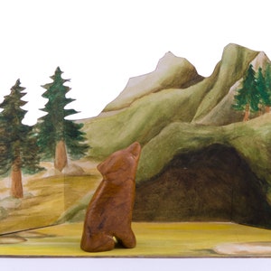 Soapstone carving wolf in front of nature scene