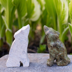 Soapstone carving wolf in front of nature scene