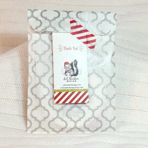 a package with a red and white striped tie on it