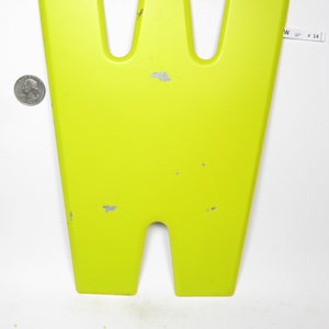 May include: A bright yellow metal letter W, 10 inches tall, with a slightly distressed finish. The letter is made of metal and has a flat back.