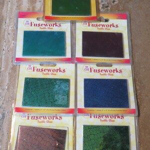 May include: Assortment of 90 COE Fuseworks fusible glass sheets in various colors, including green, blue, and brown. Each sheet measures 2 x 3 inches (5 x 8 cm) and is packaged in a clear plastic blister pack.