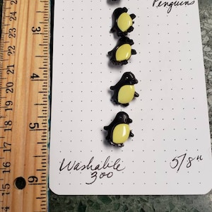 Penguin button sets snap together