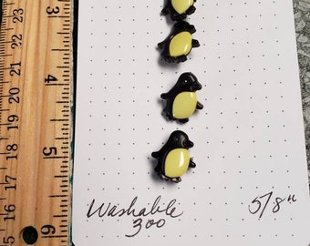 Penguin button sets snap together