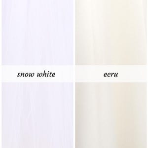 May include: Two fabric swatches, one snow white and one ecru.