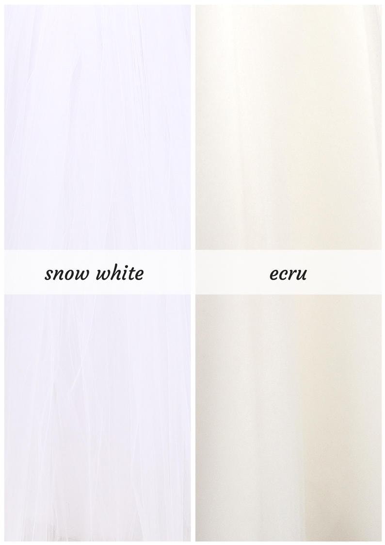 May include: Two fabric swatches, one snow white and one ecru.