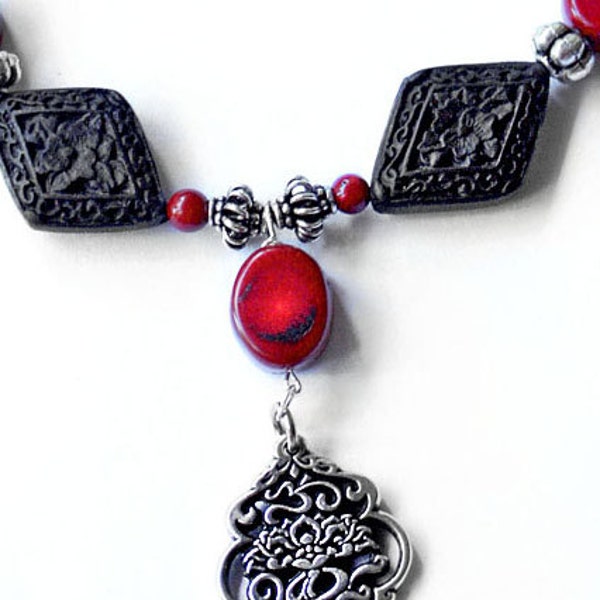 Om pendant, pewter, coral beads cinnabar beads