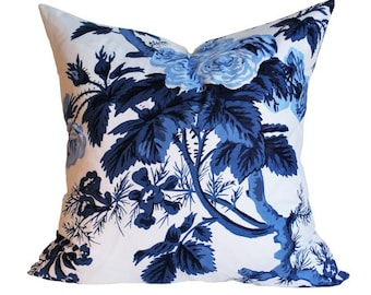 May include: Blue and white floral pillow cover with a large floral pattern. The pillow cover features a white background with blue flowers and leaves.