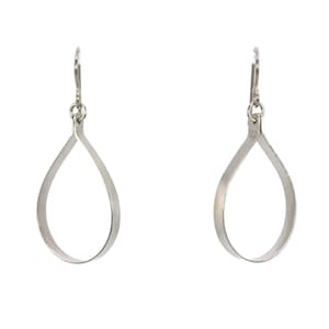 May include: A pair of silver teardrop-shaped earrings with a simple, minimalist design.