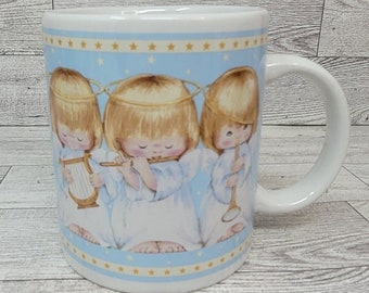 Taza de café con ángeles navideños de Hallmark, instrumento musical de cacao, trío azul