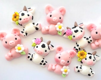 Adornos de arcilla con forma de animales de granja: Vaca y cerdo con flores (Juego de 2)