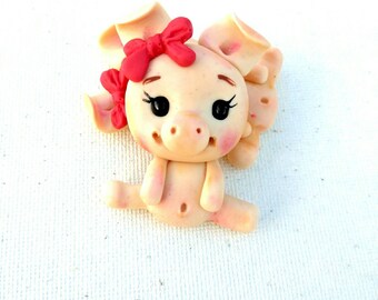 Piggies clay centers, piggy clay bow center with red bow