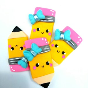 Yellow pencil clay center, pencil bow center, yellow pencil with blue bow appliques