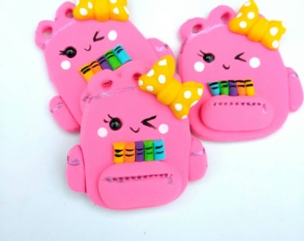 Pink backpack clay center, Handmade pink backpack clay with colorful crayons, clay bow center