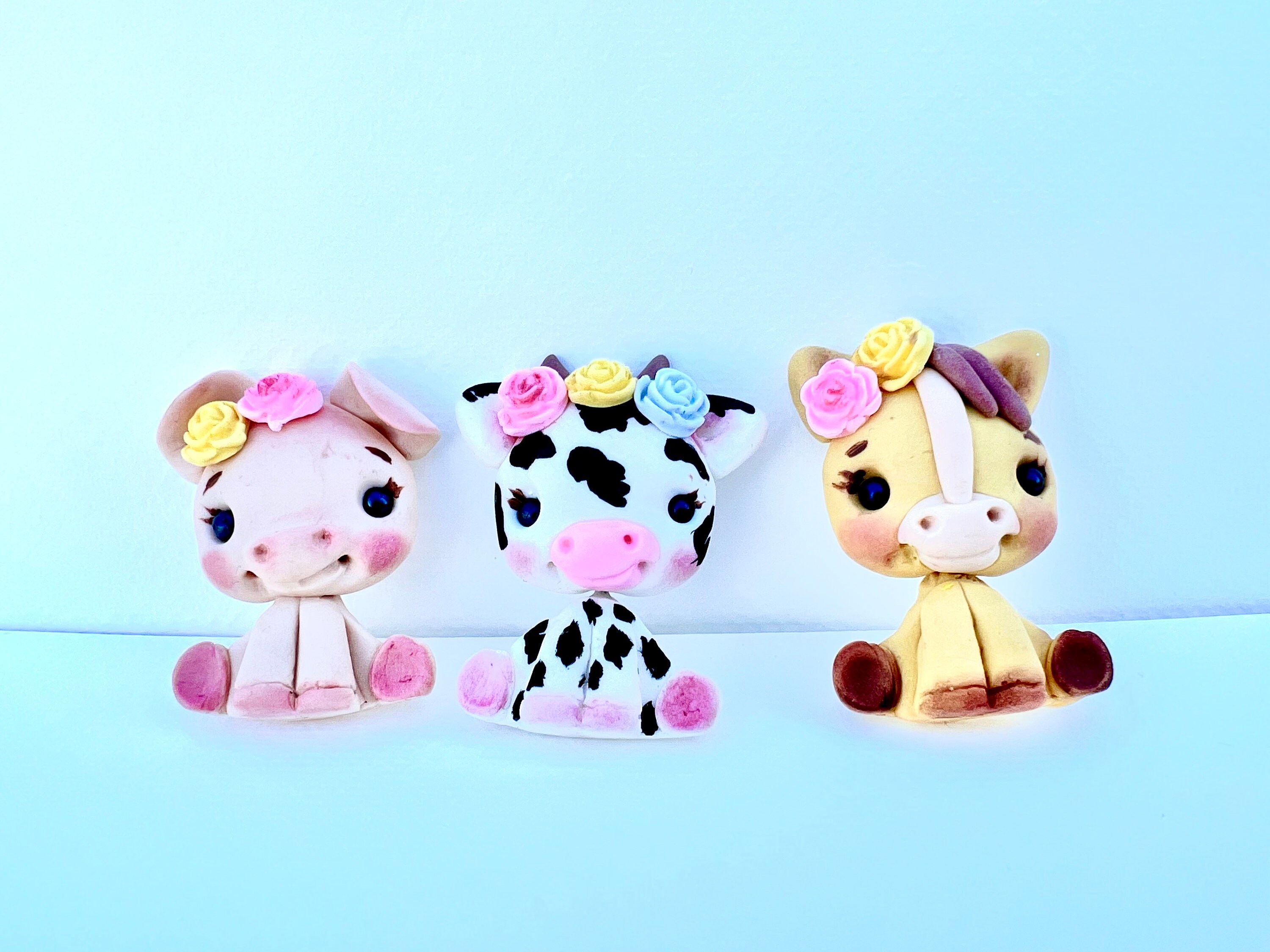 farm animal clay centers, black and white cow bow center, farm clays, pig clay, sheep clay