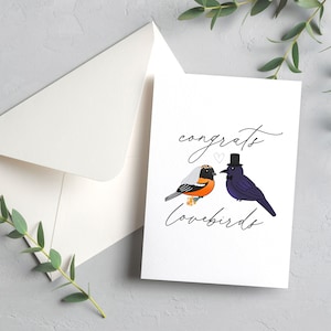 Felicitaciones a los tortolitos / Novia y novio de Baltimore Raven y Oriole / Tarjeta de boda de 4,25 x 5,5" / Sobre incluido / Interior en blanco