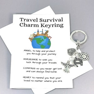May include: A silver travel charm keyring with a compass, angel, horseshoe, and heart charms. The keyring comes with a card that reads "Travel Survival Charm Keyring" and explains the meaning of each charm.  "ANGEL to help and protect you through your journey. HORSESHOE to wish you luck through your travels. COMPASS so you never get lost, and can always find home. HEART to remind you that your loved no matter where you are."