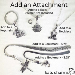 May include: Silver charm options for adding to a keychain, necklace, or bookmark. Charms include a horse, a lotus flower, a heart with the words "I love soldiers", a dragonfly, and a cat. The text "Add to a Bails Bracelet Not Included" is also visible.