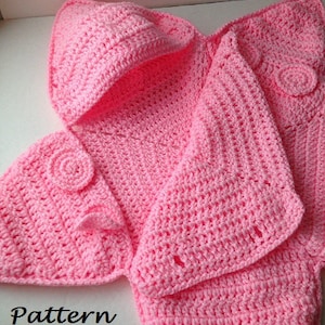 May include: Pink crocheted baby blanket with a hood and buttons. The blanket is made with a simple stitch and has a delicate, feminine look.  Pattern Only.