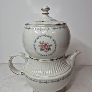 May include: A rustic wooden sign with the text "Welcome to our home" in white lettering. The sign features a distressed finish and a simple, inviting design, perfect for a front porch or entryway.