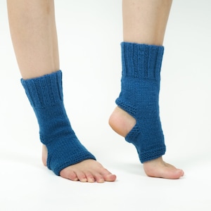 May include: A pair of blue knitted ankle warmers with an opening at the heel. The warmers are made of a soft, stretchy material and are perfect for keeping your feet warm in the winter.