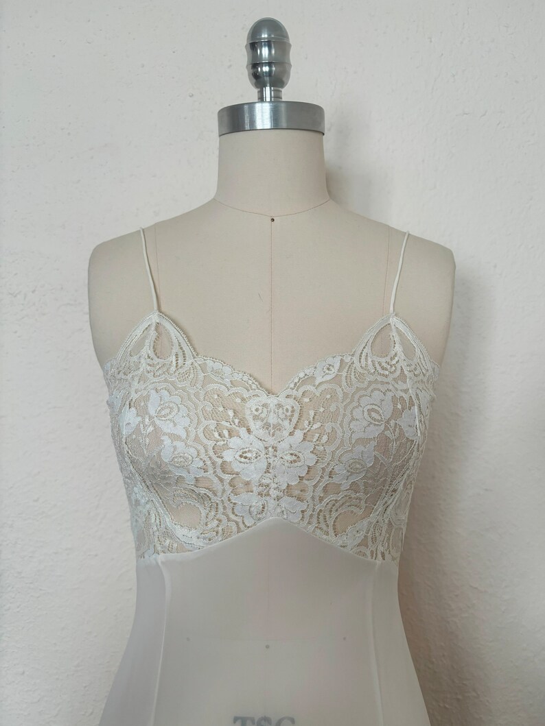 Bodice front view of 2000s y2k vintage new with tags white georgette and lace sheer floor length nightgown with train by Jane Woolrich, size extra small to small.