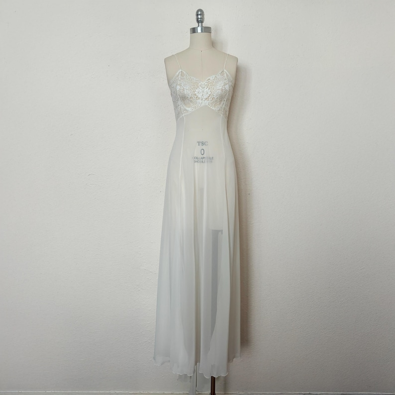 Front view of 2000s y2k vintage new with tags white georgette and lace sheer floor length nightgown with train by Jane Woolrich, size extra small to small.