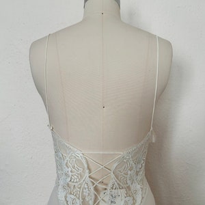 Bodice back view of 2000s y2k vintage new with tags white georgette and lace sheer floor length nightgown with train by Jane Woolrich, size extra small to small.