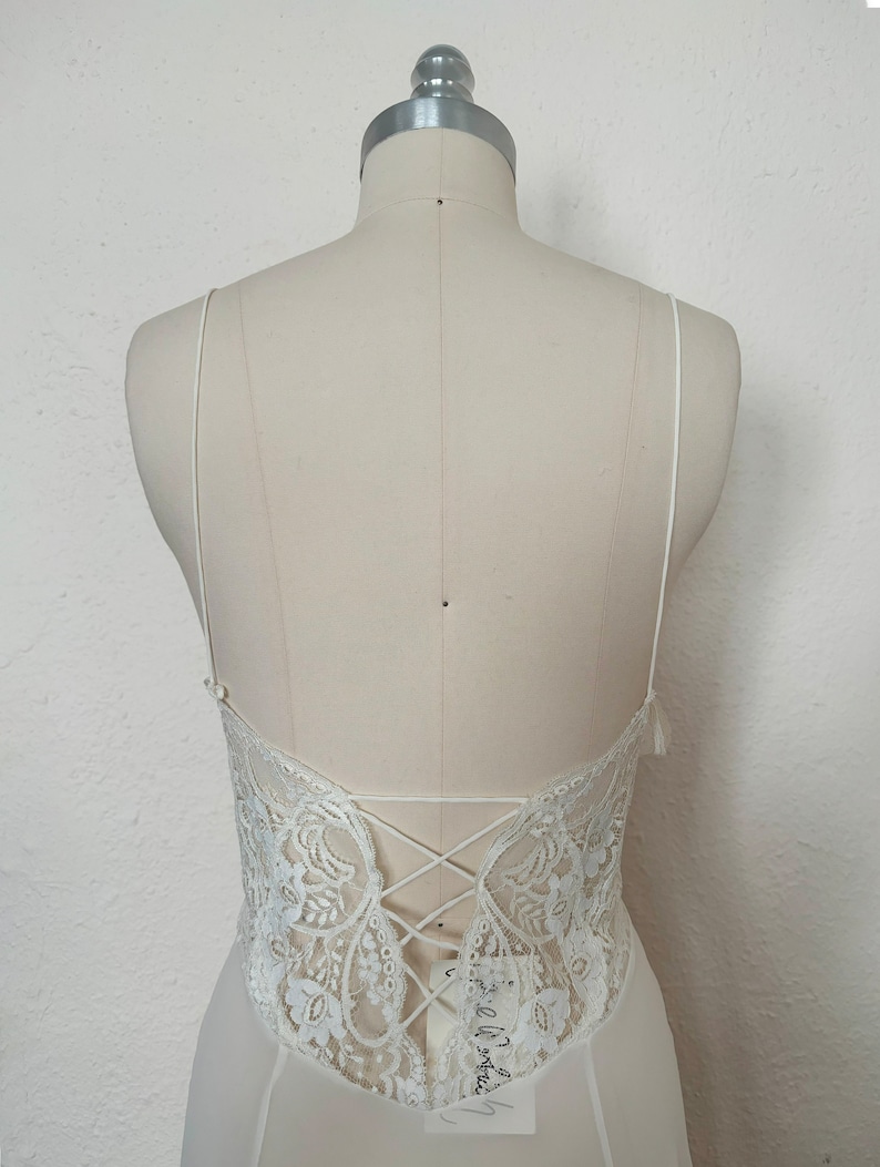 Bodice back view of 2000s y2k vintage new with tags white georgette and lace sheer floor length nightgown with train by Jane Woolrich, size extra small to small.