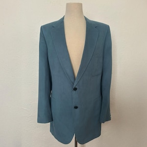 May include: A blue blazer with a single button closure and a pocket on the left side.