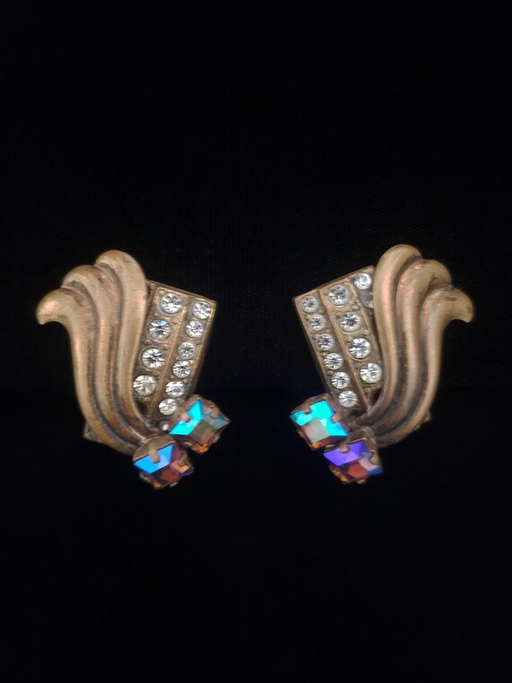 1980s Brass and Iridescent Purple Rhinestone Clip Ear… Gem