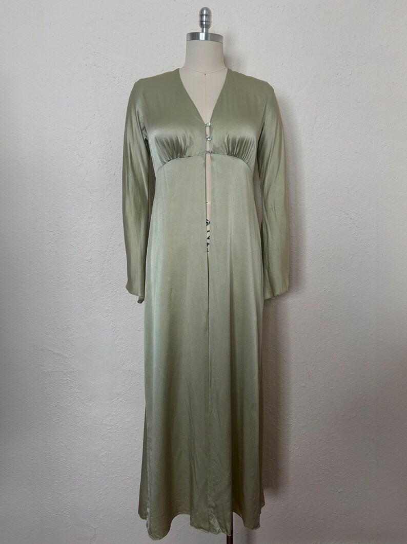 Front view of 2000s y2k vintage new with tags sage green silk charmeuse robe by Patricia Fieldwalker, size medium to large.