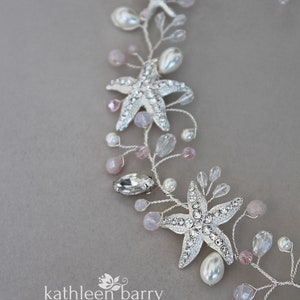 May include: A silver and pink beaded hair vine with starfish charms. The vine is decorated with small pearls and pink beads. The text "kathleen barry co. 2023 SOFT PINKS" is visible at the bottom of the image.