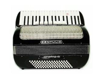 May include: A black accordion with silver trim and the word "CANTULIA" in silver lettering on the front. The accordion has a white keyboard and a black and white bellows.