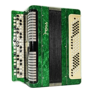 May include: A green accordion with a marbled finish. The instrument has black and white keys and buttons, with a black bellows. The name "Этюд" is printed on the front. The accordion is a musical instrument.