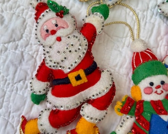 Vintage Christmas Ornament set of 4 Bucilla Santa Snowman Sledding Skating 1970s Handmade Felt