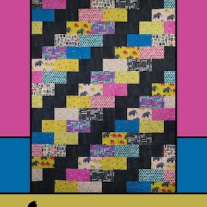 May include: A colorful quilt with a black background and rectangular blocks of various patterns and colors, including pink, yellow, blue, and patterned fabrics. The quilt has the text "Going Up" at the top and the designer's name at the bottom.
