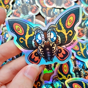 Mothra HOLOGRAPHIC Vinyl Sticker | Fantasy Sticker, Shiny, alternative, dark, kaiju sticker, chibi kaiju, tiny Mothra, alternative