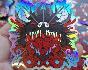 May include: A holographic sticker featuring a dark, monstrous creature with sharp, iridescent teeth and red, tentacle-like appendages. Three arrows cross behind the creature's head. The text "PHASE MOTH" is printed in the bottom right corner.