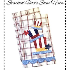 May include: Two red and white checkered tea towels with a blue scalloped edge. The top towel has a red, white, and blue Uncle Sam hat applique with stars.